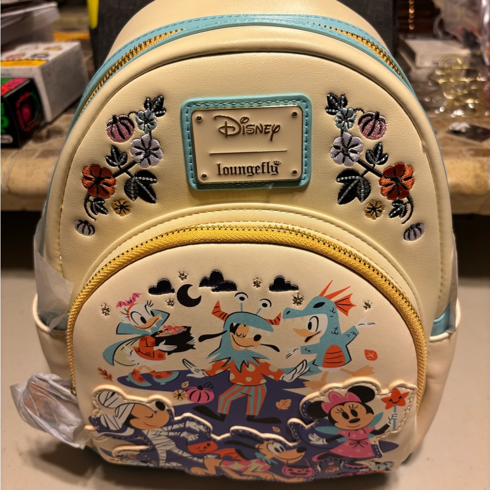 Disney Cream and Blue Backpack with Halloween Characters. Loungfly